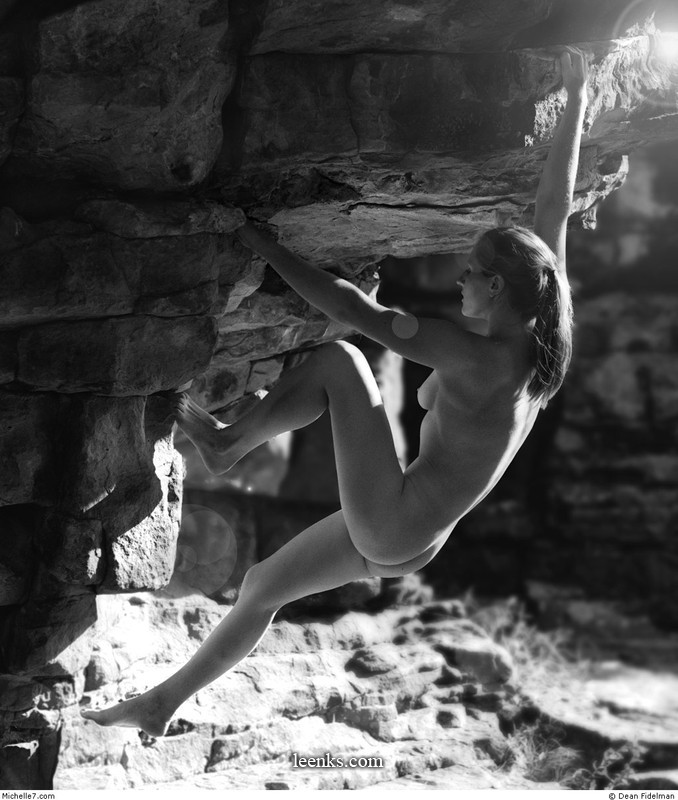Nude rock climbing.